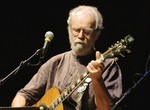 Charlie King playing guitar